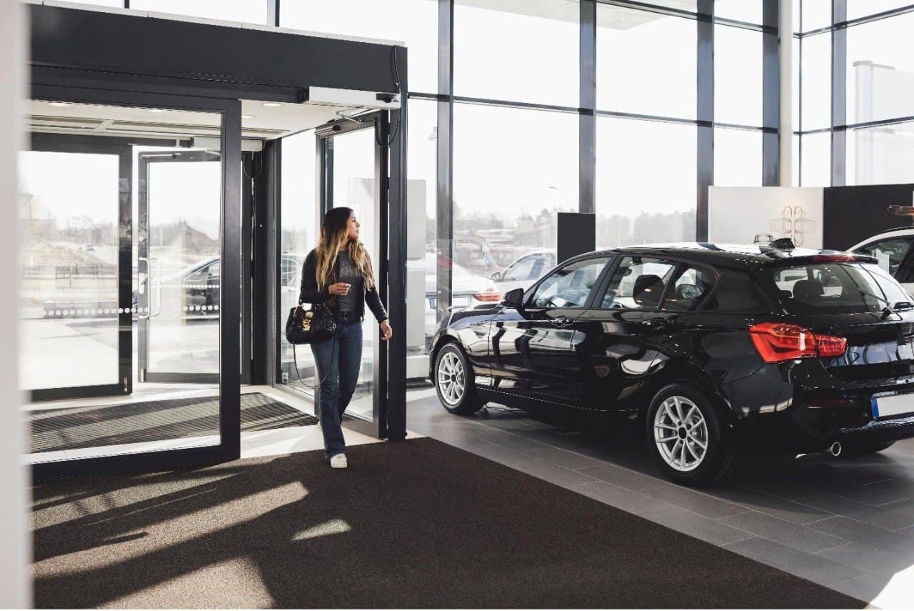 Customer arriving at a dealership showroom